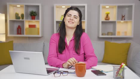 Home-office-worker-woman-expressing-her-mind-and-success-to-the-camera.